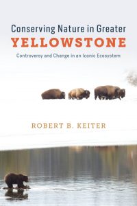 Book cover for "Conserving Nature in Greater Yellowstone" by Robert B. Keiter, featuring bison on snow and a bear by water