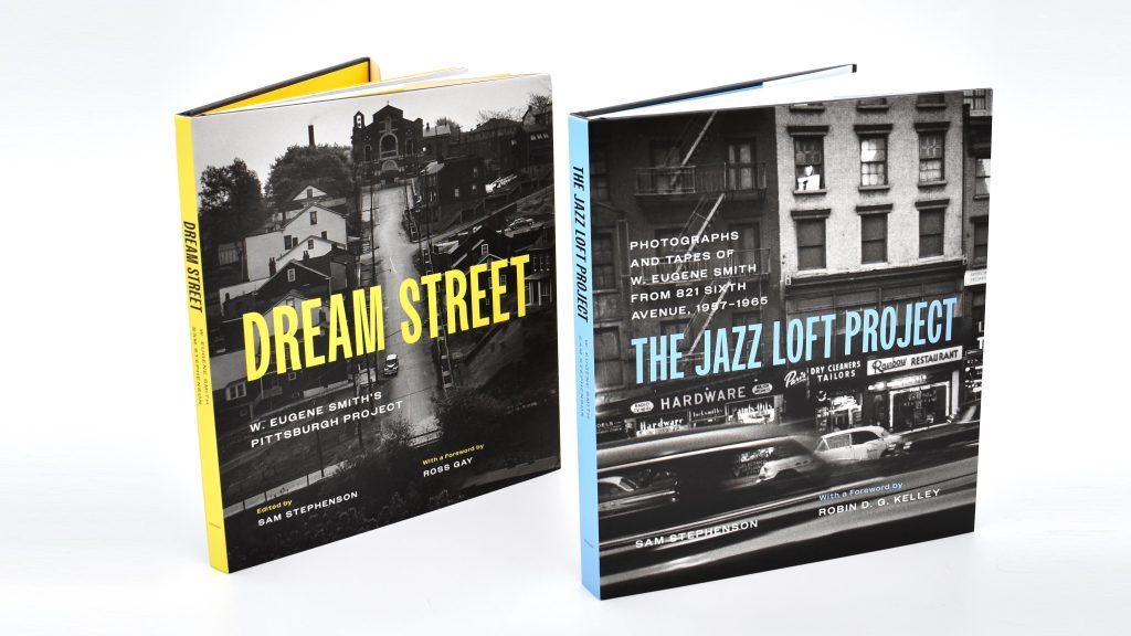 Photograph of two books against a white backdrop. The books are titled “DREAM STREET” and “THE JAZZ LOFT PROJECT,” and each book cover features a black and white photograph.